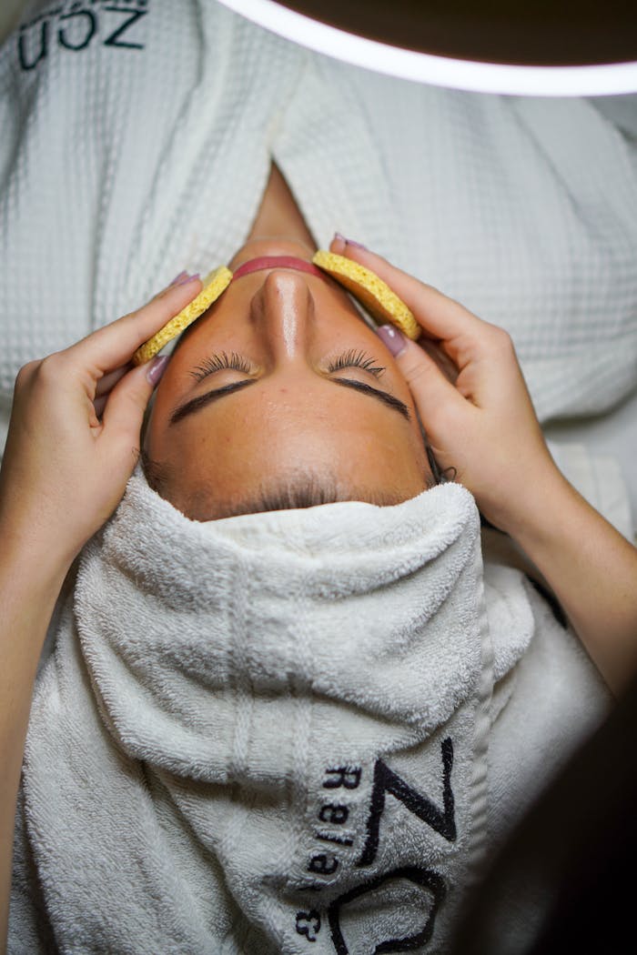 our-mission Relaxing spa treatment with facial and sponge massage in a serene environment.